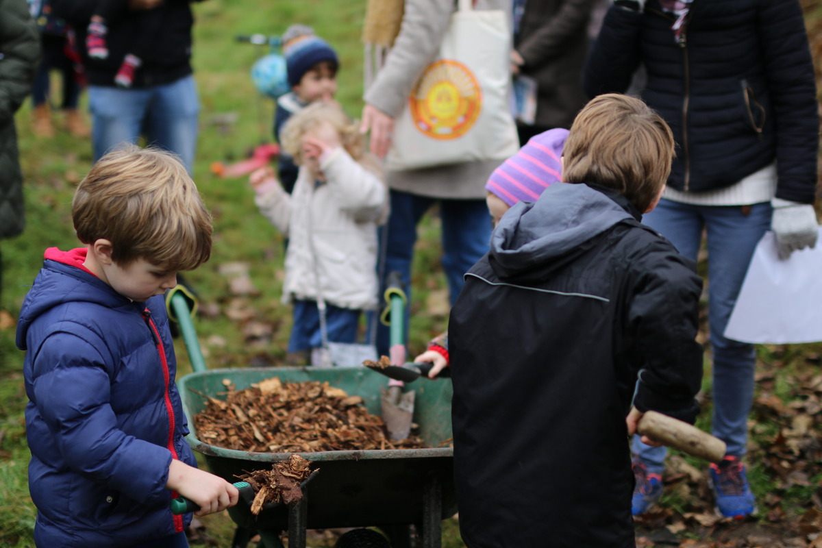 Residents' children help with the planting